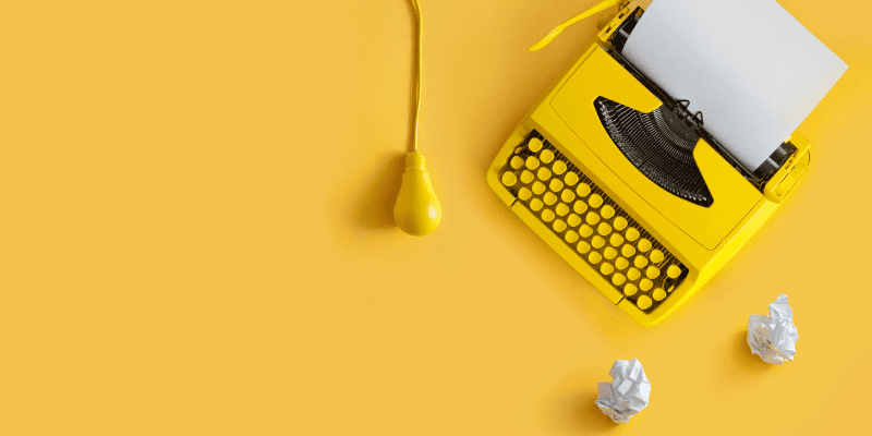 yellow typewriter on yellow table