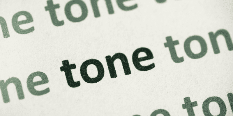 tone repeated in green letters on beige background