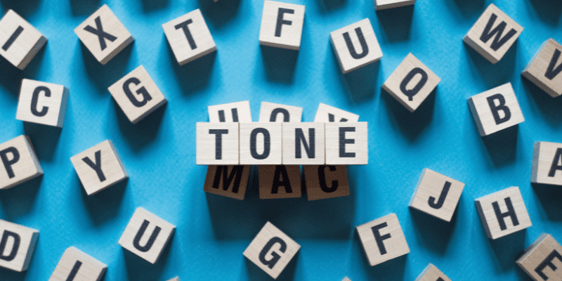 tone spelled out on white blocks on a blue background