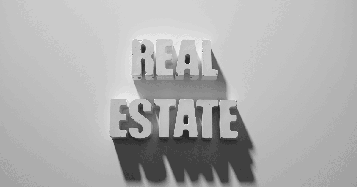 Real Estate spelled out in 3D white letters