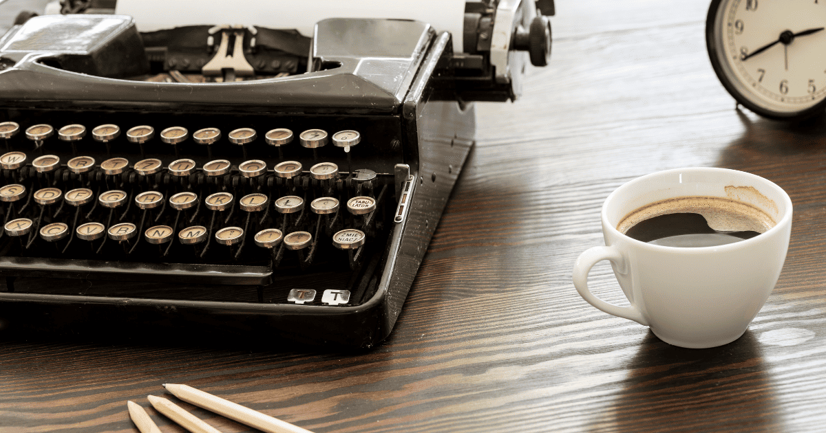 typewriter on wood desk